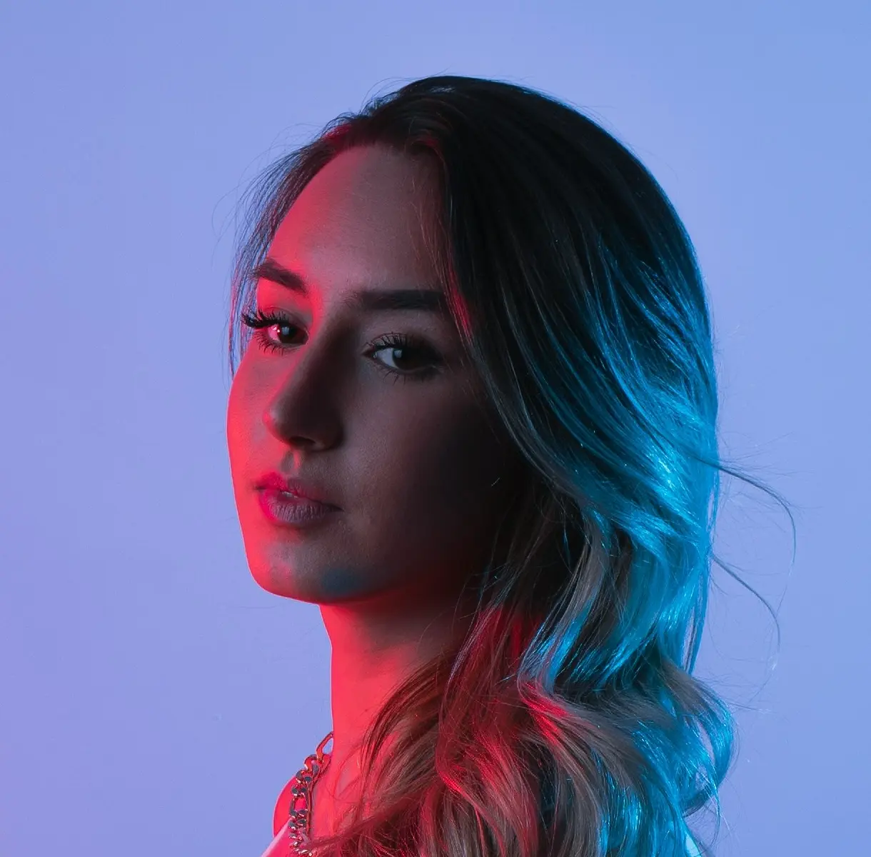 Kas bouncing a basketball on a court outside